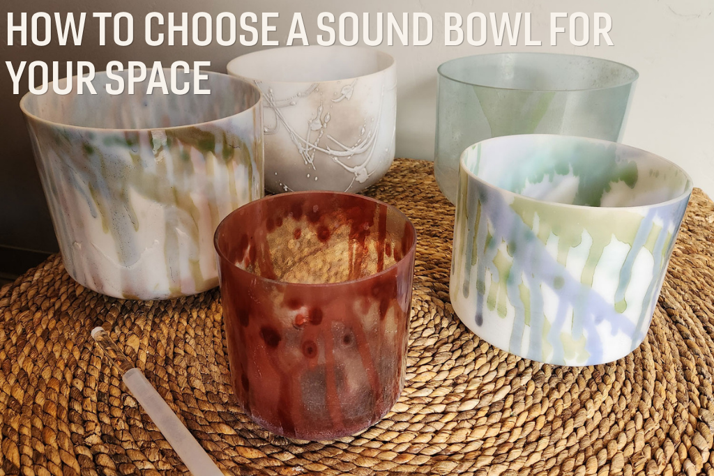 Five sound bowls sitting on a wicker table